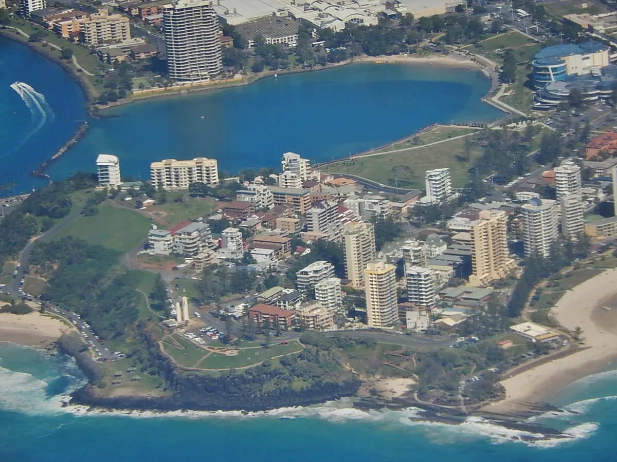 Aerial view of Point Danger headland and lighthouse between Rainbow Bay and the Tweed River mouth